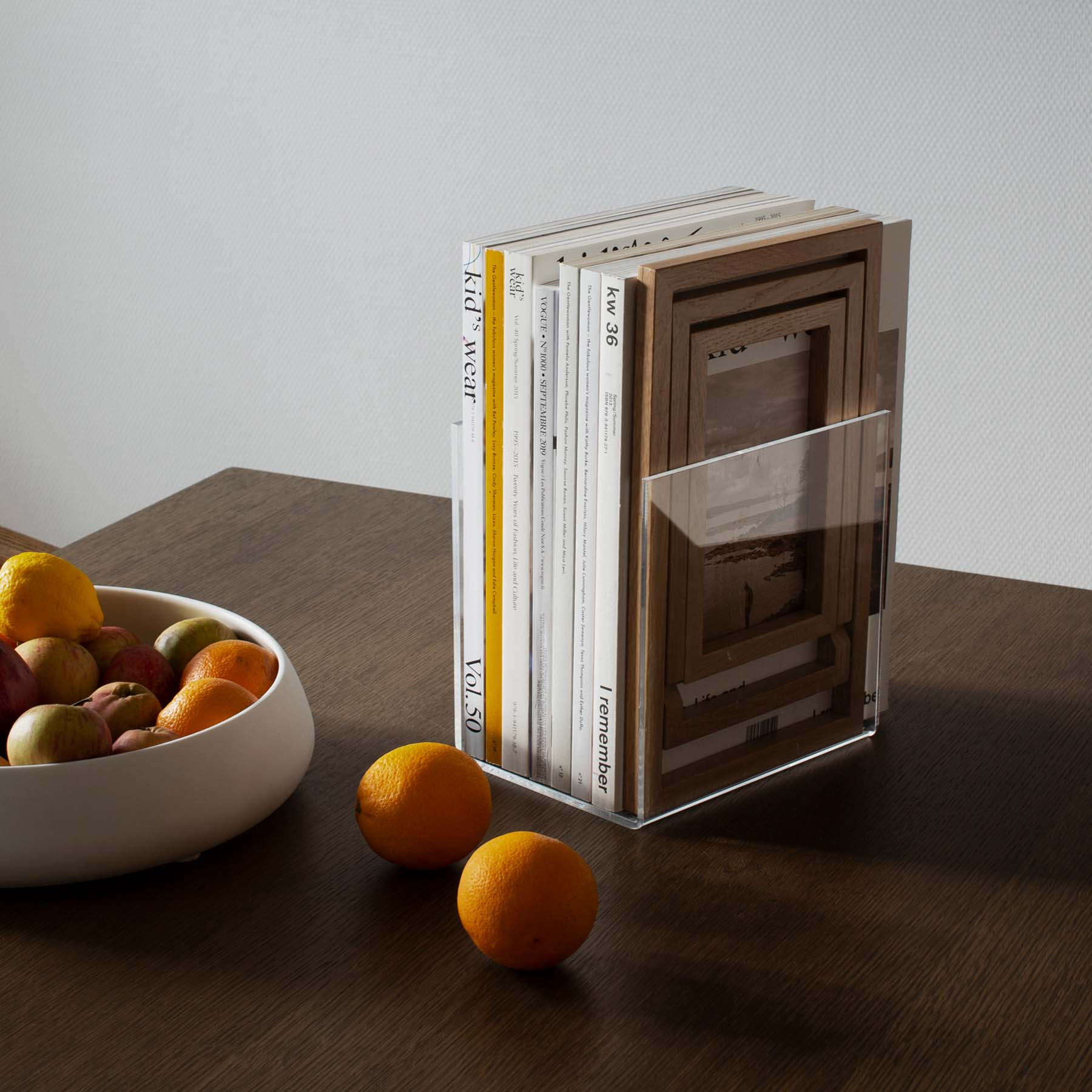 Acrylic book holder with magazines